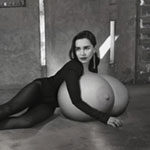 Em.Cl. on the floor lying on her huge tits