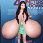 Bh.Bh. exposing her huge pendulous tits in public