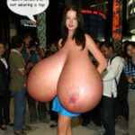 Ra.Ni. massive tits topless in a crowd of photographers
