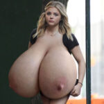 Ch.Mo. exposing her giant big tits out walking