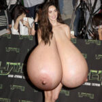 Me.Fo. in a movie premiere naked in heels exposing her giant heavy tits out