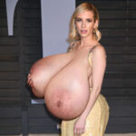 Em.Ro. in a fancy night dress exposing her huge tits out in public