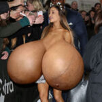 Ar.Gr. exposing her giant silicone tits in front of her fans