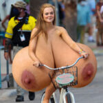 El.Fa. riding her bicycle exposing her giant tits out