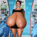 Sh.Wo. in a skimpy dress revealing her huge big tits