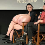 Da.Ri. resting her massive bit tits on her lap in public