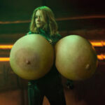 Br.La. as Captain Marvel exposing massive silicone tits