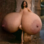 Glamorous An.Ar. exposing her giant tits in an alley