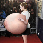 E.W. holding her giant silicone tits out to the crowd