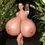 Ph.Dy. naked in heels exposing her huge round tits