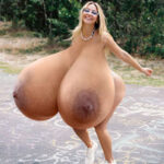 Ma.Cl. in a sexy bikini jumping and bouncing her naked huge tits in a park