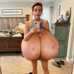 E.W. at home taking a selfie with her massive tits out