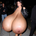 Ky.Je. flopping her huge pendulous tits out in public