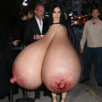 Ch.XCX. goes topless exposing her giant tits in the street
