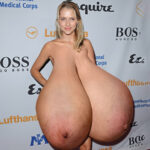 Teresa P. naked in heels exposing her massive tits to the public