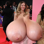 Sy.Sw. exposing her huge tits on the red carpet