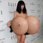 Kr.Ri. exposing her giant silicone tits in public