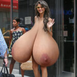 Ze. naked in heels flopping her hug pendulous tits in public